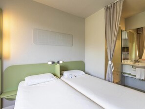 Desk, blackout curtains, free cots/infant beds, free WiFi