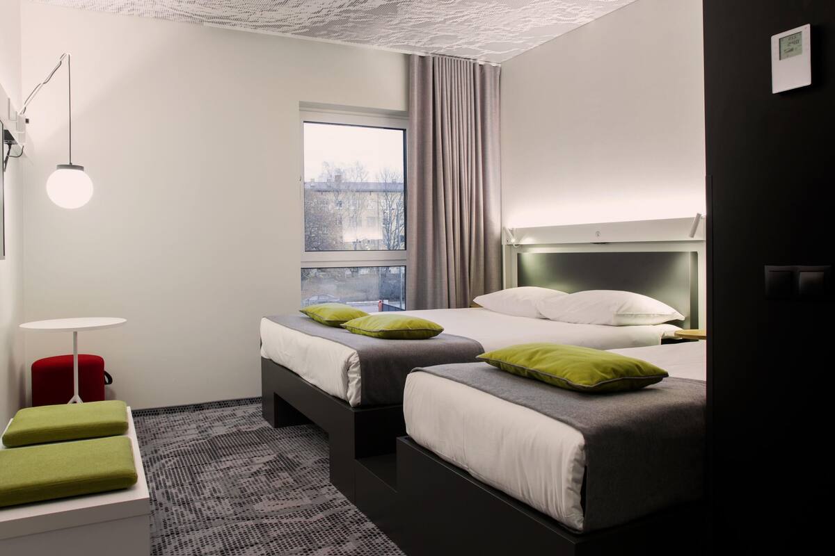 triple room, multiple beds | in-room safe, blackout curtains, soundproofing, iron/ironing board