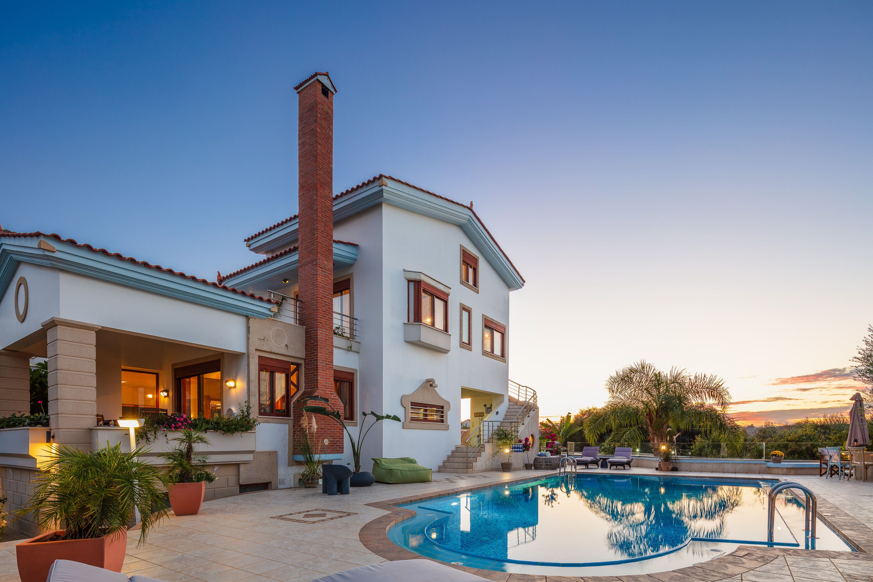 A heated pool, sun loungers