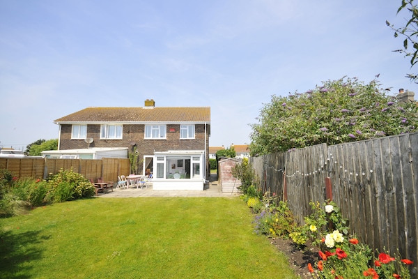 A sunny south-facing back garden, perfect for kids and eating outside...