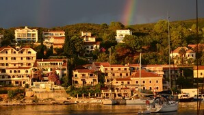 A coastal town with buildings, a marina, and a rainbow in the sky. - SPACIOUS VILLA - OWN PRIVATE POOL, WIFI,  STUNNING SEA VIEWS (Bigova)
