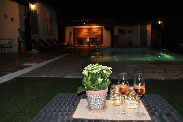 A heated pool, sun loungers