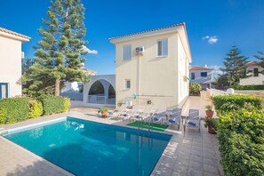 A heated pool, sun loungers