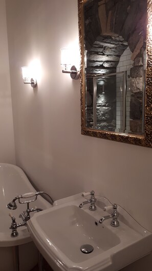 Bathtub, hair dryer, towels, soap