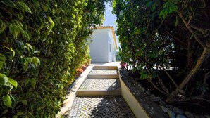 A pathway leading to a building with a tiled entrance. - Villa Marazul Quinta Amizade w/ Sea View, Games room, Salt pool (Guia)