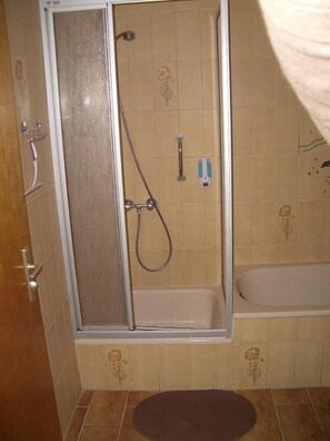 Bathtub, hair dryer, towels, soap