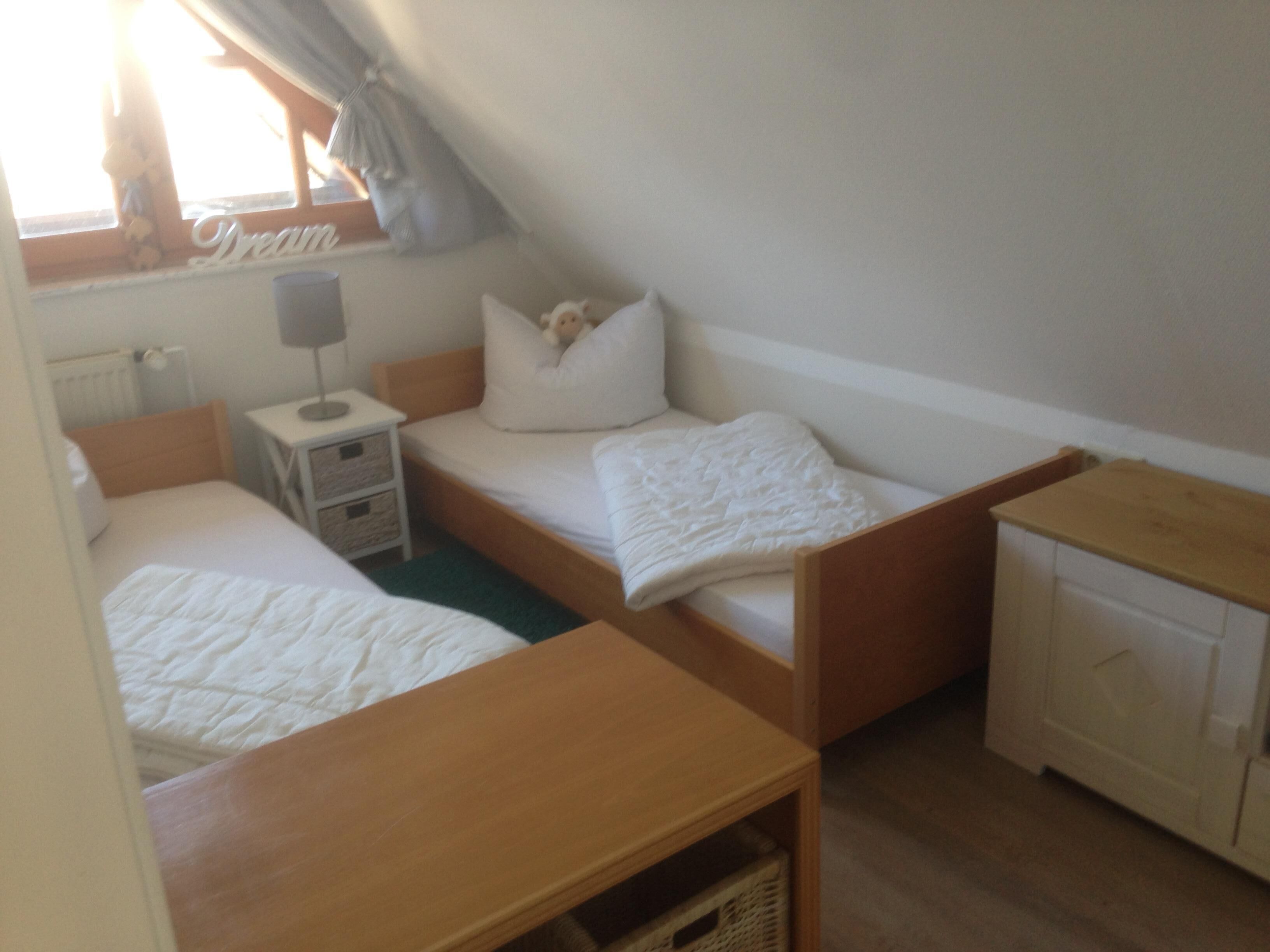 Thatched cottage surrounded by the sea