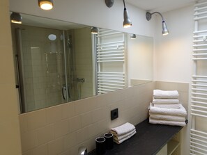Shower, hair dryer, towels, soap