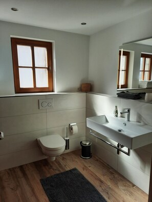 Bathtub, hair dryer, towels, soap