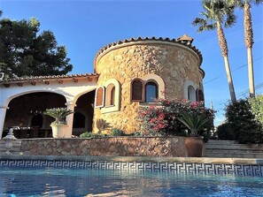 A stone building with arched windows and a pool in front. - dreamlike finca with grand pool, wonderful garden, a few minutes to the beach (Son Moja)