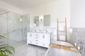 Bathtub, hair dryer, towels, soap