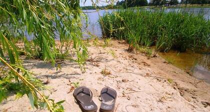 Idyllic country house with large garden near a beautiful swimming lake