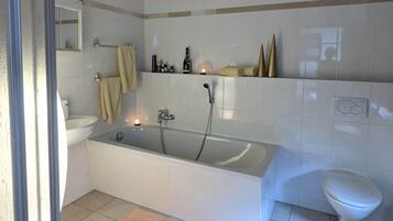 Bathtub, hair dryer, towels, soap