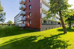 Residents enjoy balconies with outdoor space amidst a peaceful living environment.