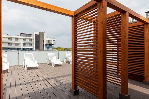 Relax on the elevated deck with lounge chairs and take in the city views.