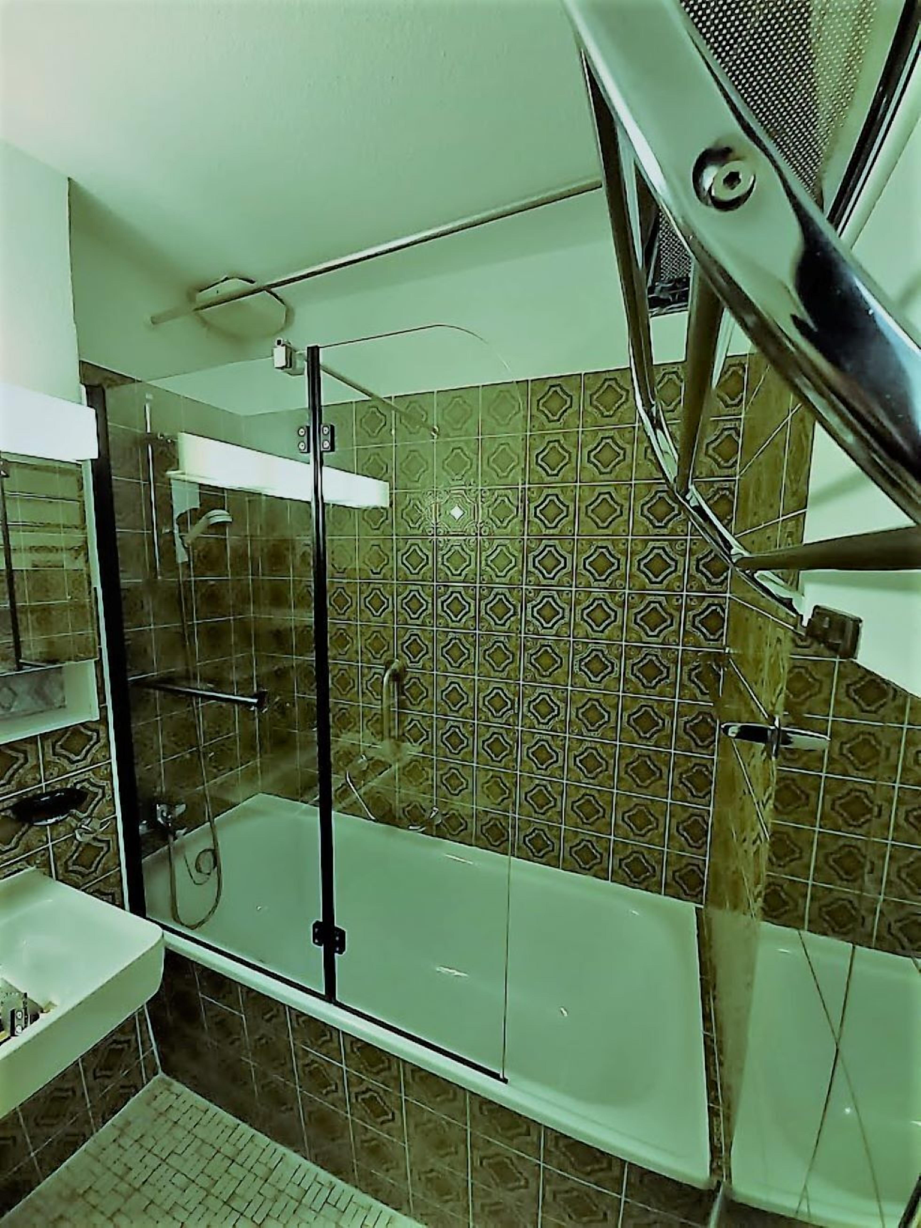 Combined shower/tub, hair dryer, towels, toilet paper