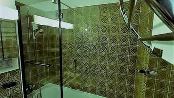 Combined shower/tub, hair dryer, towels, toilet paper