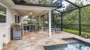 A covered outdoor area with a pool, patio furniture, and a grill. - Modern villa with large pool! Free Wifi! (Venice)