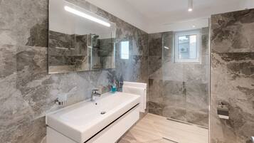 Shower, hair dryer, towels, soap