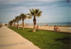 On the beach, sun-loungers