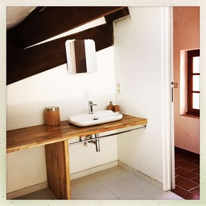 Shower, hair dryer, towels, toilet paper