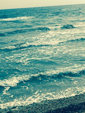 Enjoy the serene ocean views and rocky shoreline.