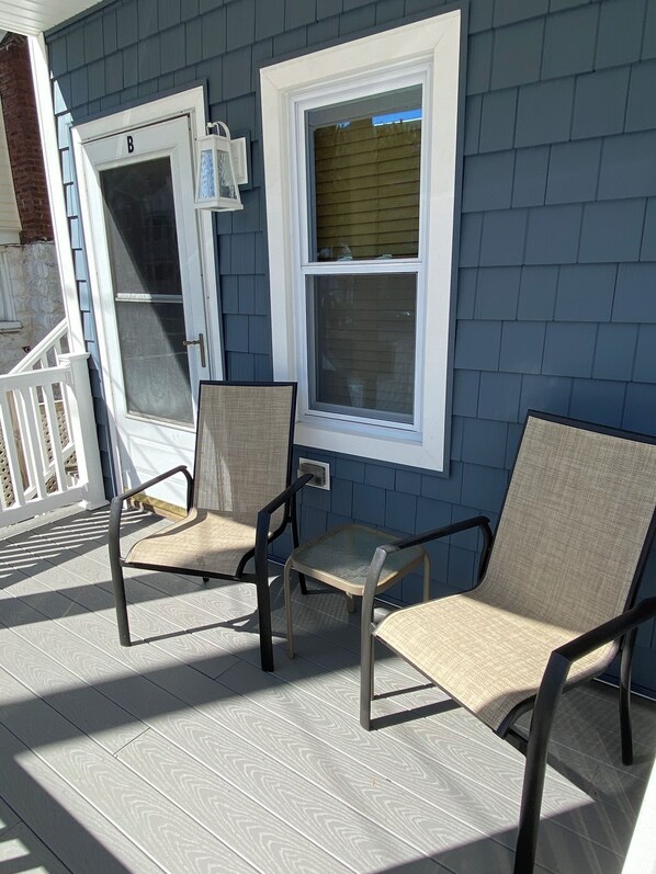 A porch with two chairs and a window. - GREAT LOCATION-Next To Beach In Beautiful OC (Ocean City)