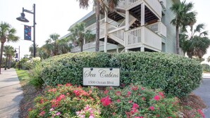 A sign for Sea Cabins at 1300 Ocean Blvd. - Oceanfront 1st Floor Condo, Unit 130!! Community Pool & Fishing Pier! Iin the Heart of IOP! (Isle of Palms)