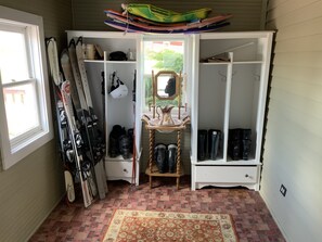 A ski storage room with skis, ski poles, and boots. - Newly renovated farmhouse with a view of Elk Mountain (Pleasant Mount)