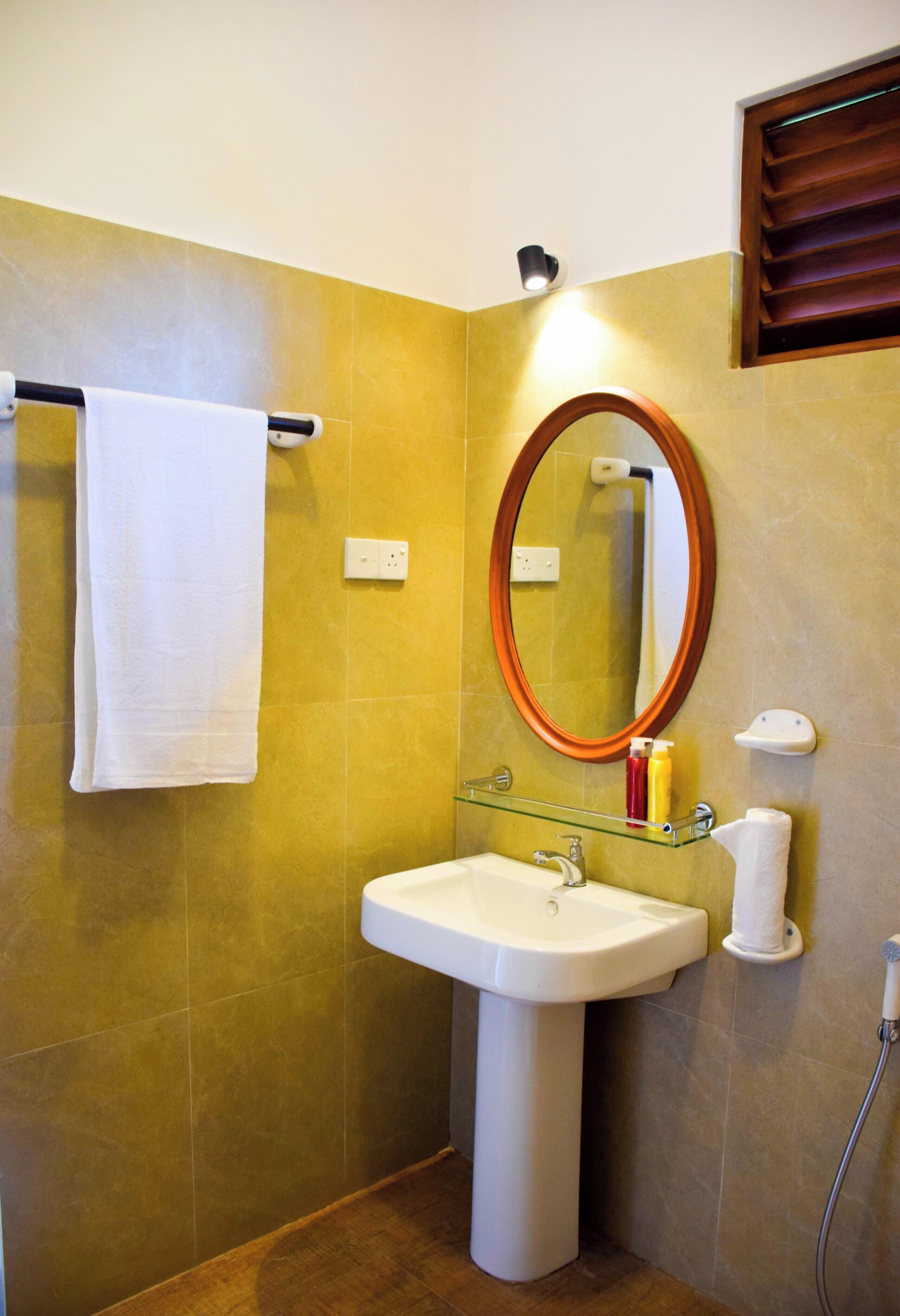Bathroom | Shower, free toiletries, slippers, towels