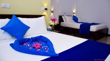 Family Room, Sea View | Minibar, in-room safe, desk, iron/ironing board