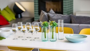 A dining table set with wine glasses, vases with succulents, and a blue bowl. - Villa Zvizdan - authentic local experience (Makarska)