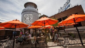 A Little Man Ice Cream stand with a large ice cream container and orange umbrellas. - Rooftop Retreat-modern townhome in the heart of LoHi- roof deck-walk everywhere! (Denver)