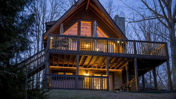 A wooden cabin with a balcony and a second floor. - Trollhaugen—Enjoy Spring and Summer in the Great Smoky Mountains (Sevierville)