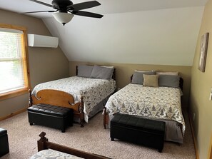 A bedroom with two beds, a ceiling fan, and a window with blinds. - 4 Bedroom, 3 full baths,  3200 sq. ft. Family Vacation Home near EVL, sleeps 12 (Great Valley)