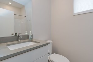 Bathtub, hair dryer, towels, soap - 
Townhome with Stunning Views & Modern Finishes (Missoula)