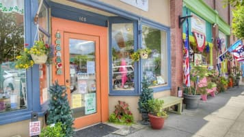 A storefront with a sign reading "Heart" and a door marked "OPEN".