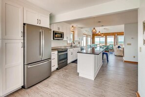 Fridge, microwave, oven, stovetop - Oceanfront Home in Avon with Hot Tub, Game Room, and Direct Beach Access (Avon)