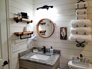 Combined shower/bathtub, hair dryer, towels, soap