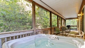 A hot tub on a wooden deck with a view of a forest. - Welcome to “The Great Escape” – Your Ultimate Family & Friends Retreat (Burnside)