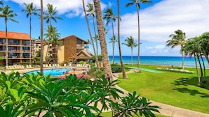 A resort with a pool, palm trees, and a view of the ocean. - Best Papakea Location - Incredible Ocean View - Fully Renovated (Lahaina)
