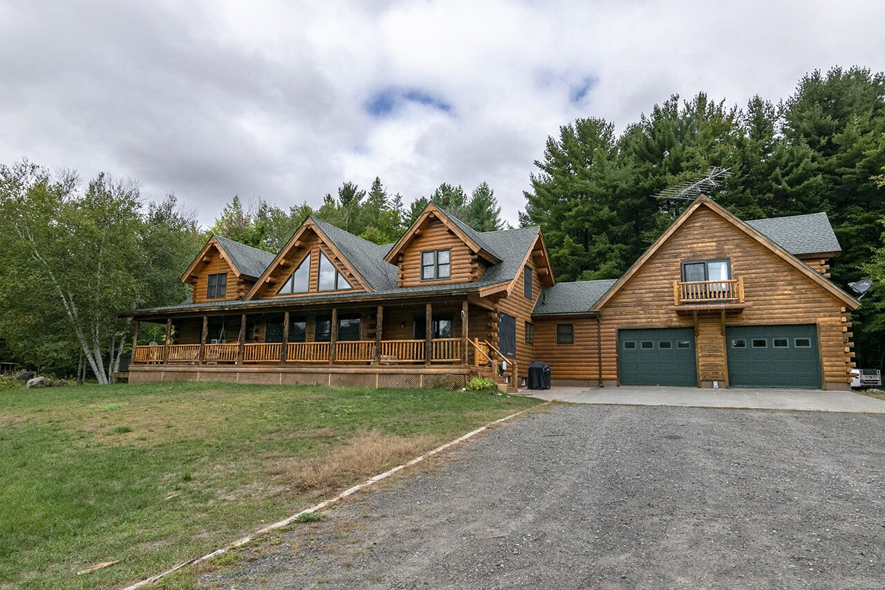 Cedar Log Home sits on 41.87 private acres with mountain and meadow views