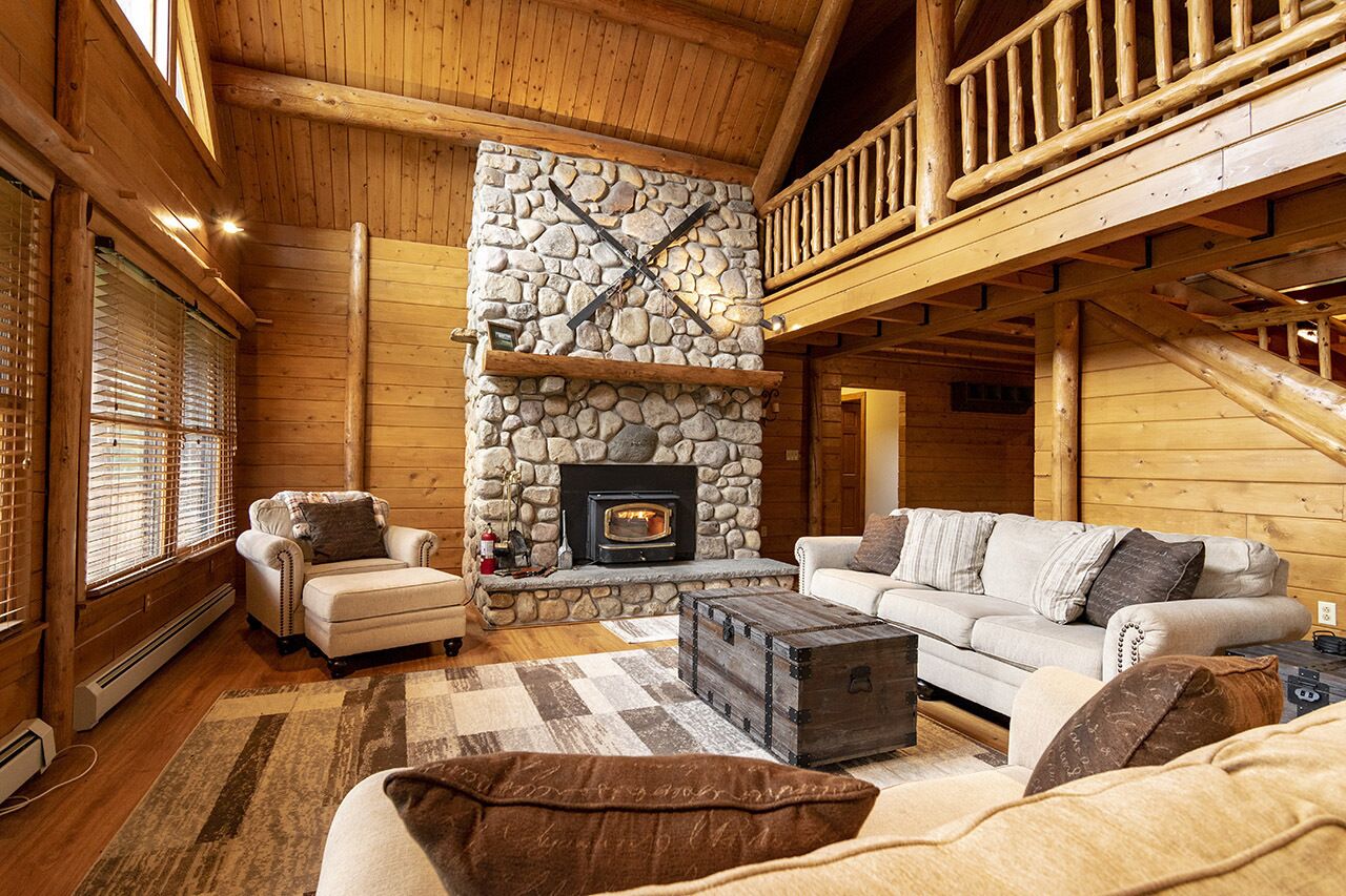 Cedar Log Home sits on 41.87 private acres with mountain and meadow views