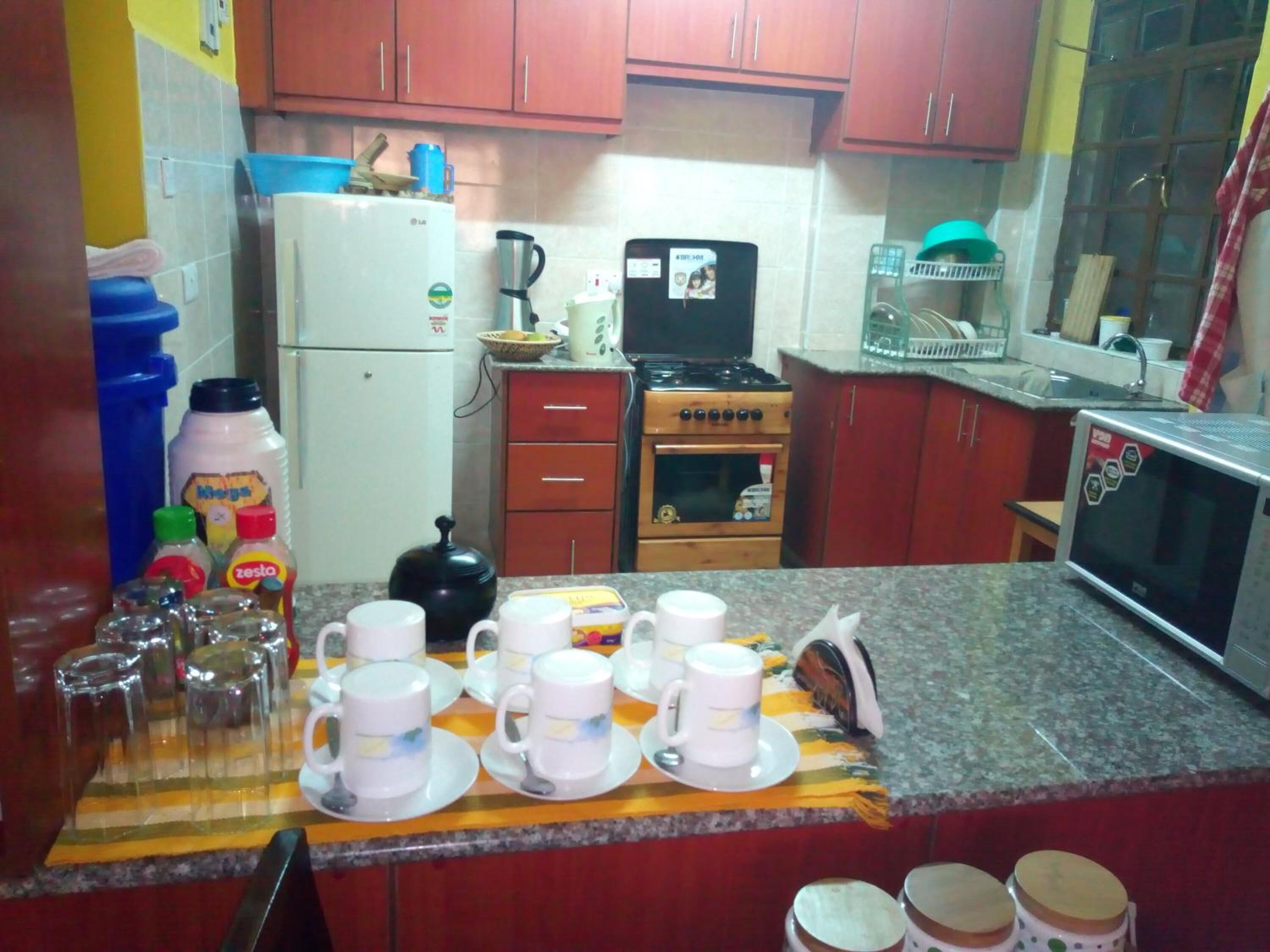 Shared fridge, microwave, electric kettle, cookware/dishes/utensils