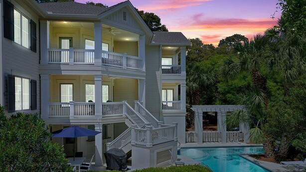A multi-story house with a pool, surrounded by lush greenery. - Stunning Ocean View Vacation House with Private Pool, 1 Min From Beach! (Hilton Head Island)