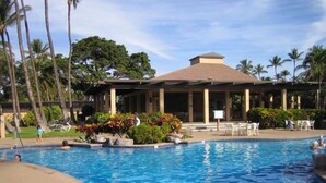 A swimming pool with lounge chairs and palm trees in the background. - Wailea Ekahi 14F - Best Views -  3 Minutes Walk to Beach (Wailea-Makena)