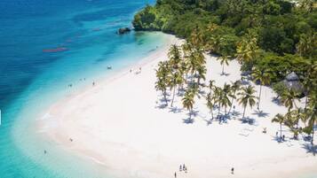 On the beach, sun loungers, beach towels