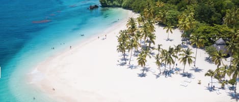 On the beach, sun loungers, beach towels