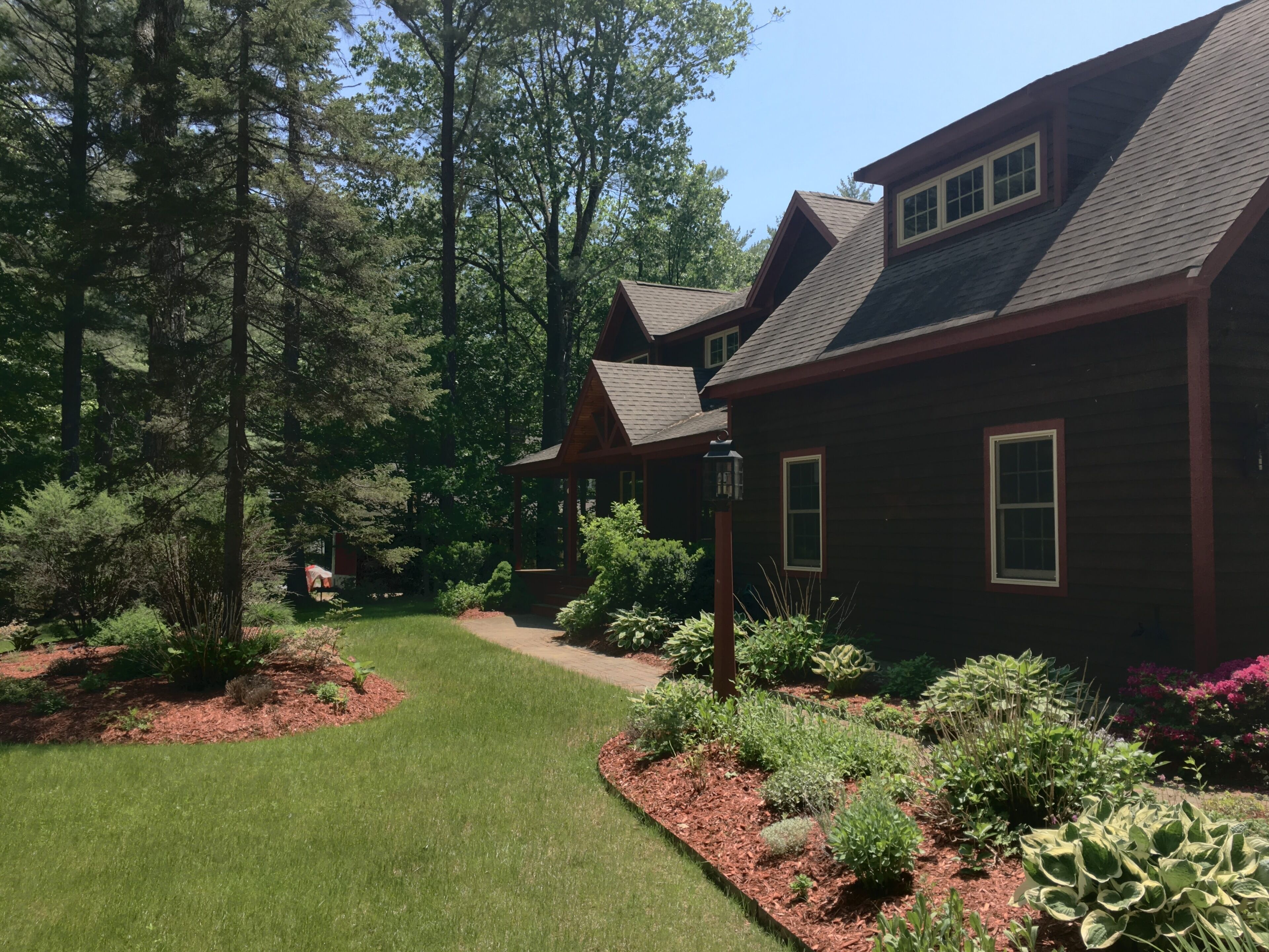 Side of House with nicely landscaped yard.