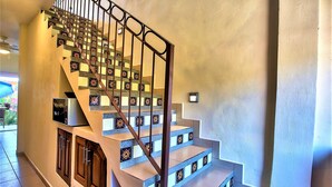 A staircase with patterned steps and a metal railing.